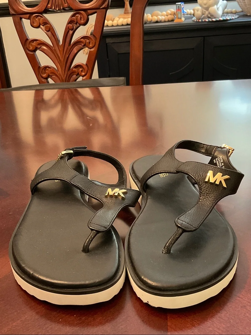 Michael Kors Black Thong Sandals with Gold MK Hardware